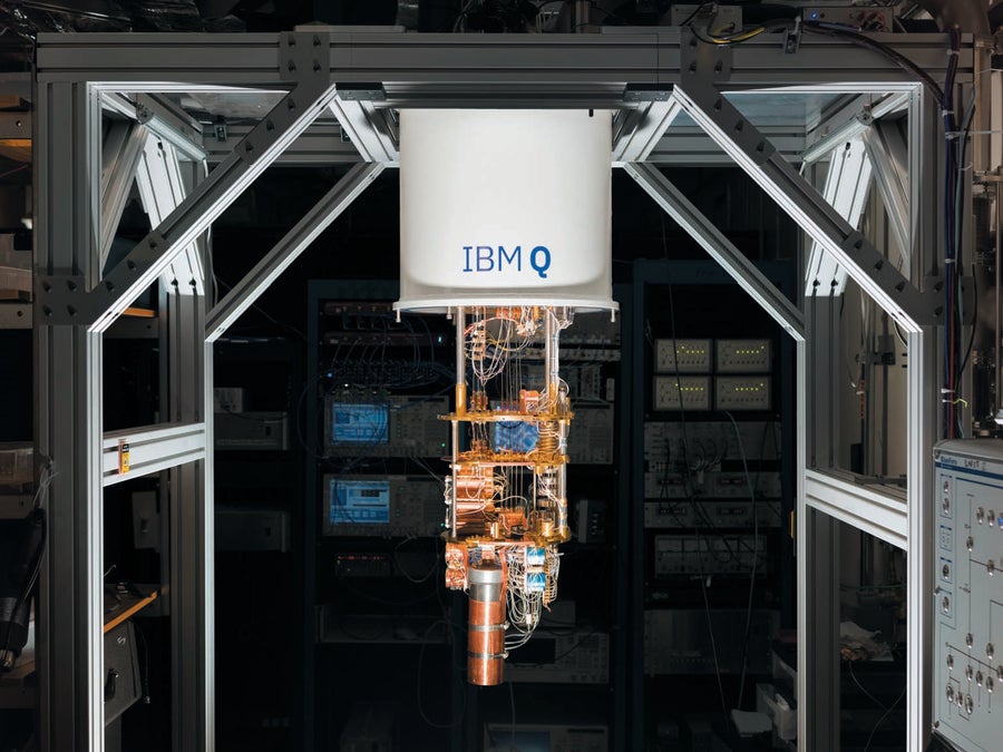 Quantum computer hanging from a frame shown in a computer research lab.